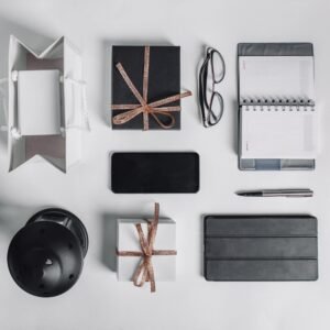 Branded corporate gifts including mugs, tech gadgets, and eco-friendly hampers with logos