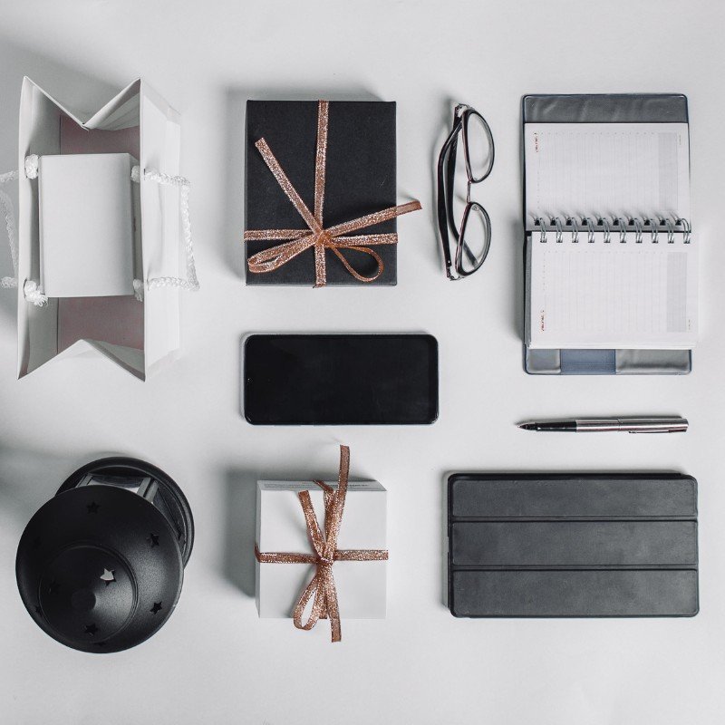 Branded corporate gifts including mugs, tech gadgets, and eco-friendly hampers with logos