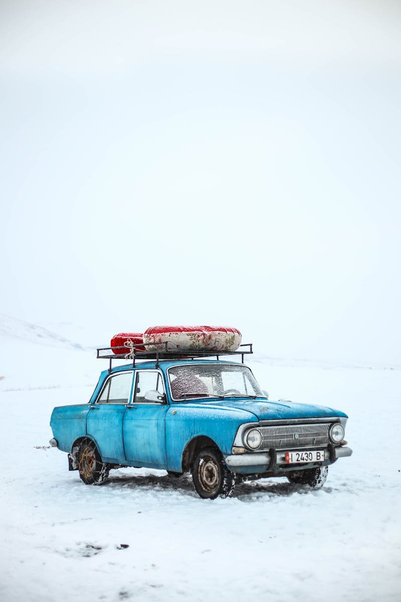 pexels-photo-845405-845405 Classic blue car in snowy winter scene, Ak-Talaa District, Kyrgyzstan.